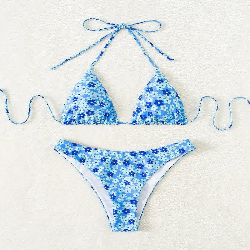 Women's blue printed swimsuit with lace-up front and matching shorts, showing split detail and Asian sizing options