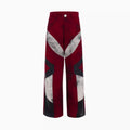 Men's red wide leg jeans with leather patchwork splicing detail, medium high waist, zipper closure