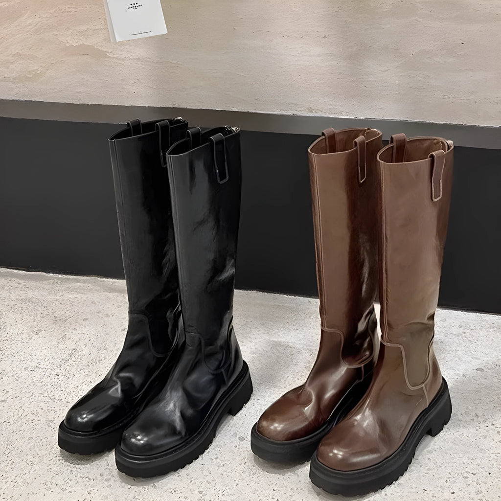 Black chunky heel knight boots with round toe and high shaft, showing the back zip detail.