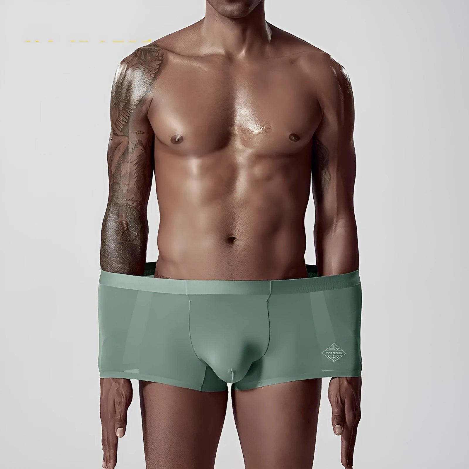 Men's seamless modal underwear in mid-waist fit, shown in green colour.