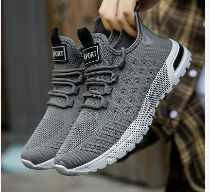 Men's solid colour casual shoes with a mesh upper, shown in multiple available colours.