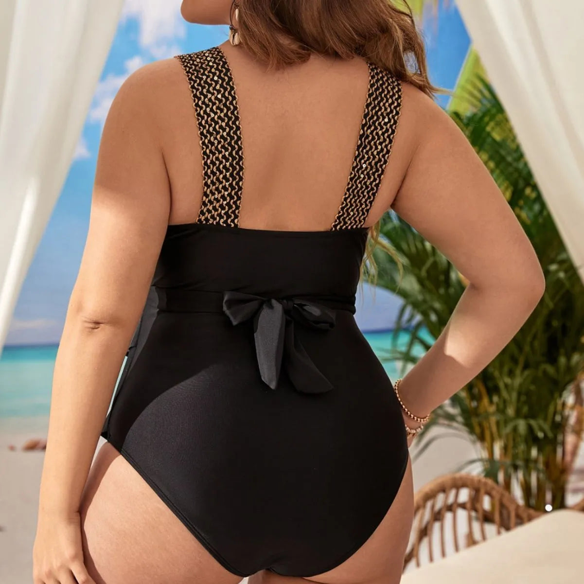 Women's black one-piece sleeveless swimsuit with chest pad, shown on a mannequin.