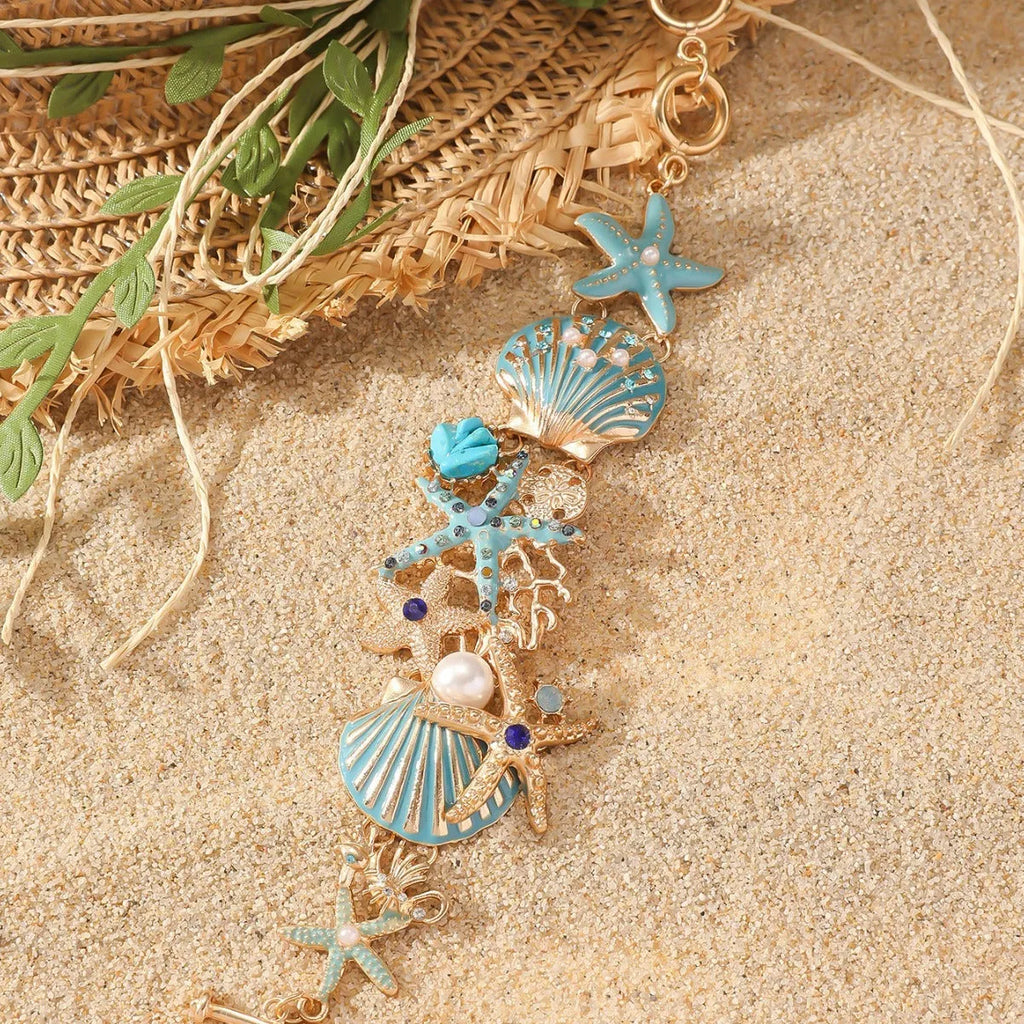 Alloy boat anchor and starfish rhinestone bracelet for women in turquoise, coral red, or coral blue.