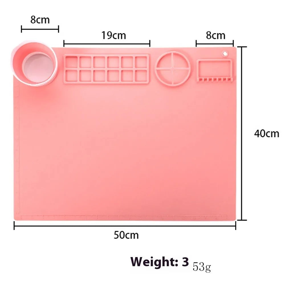 Green silicone painting mat measuring 50 by 40 cm, shown with two integrated bowls for paint or water.
