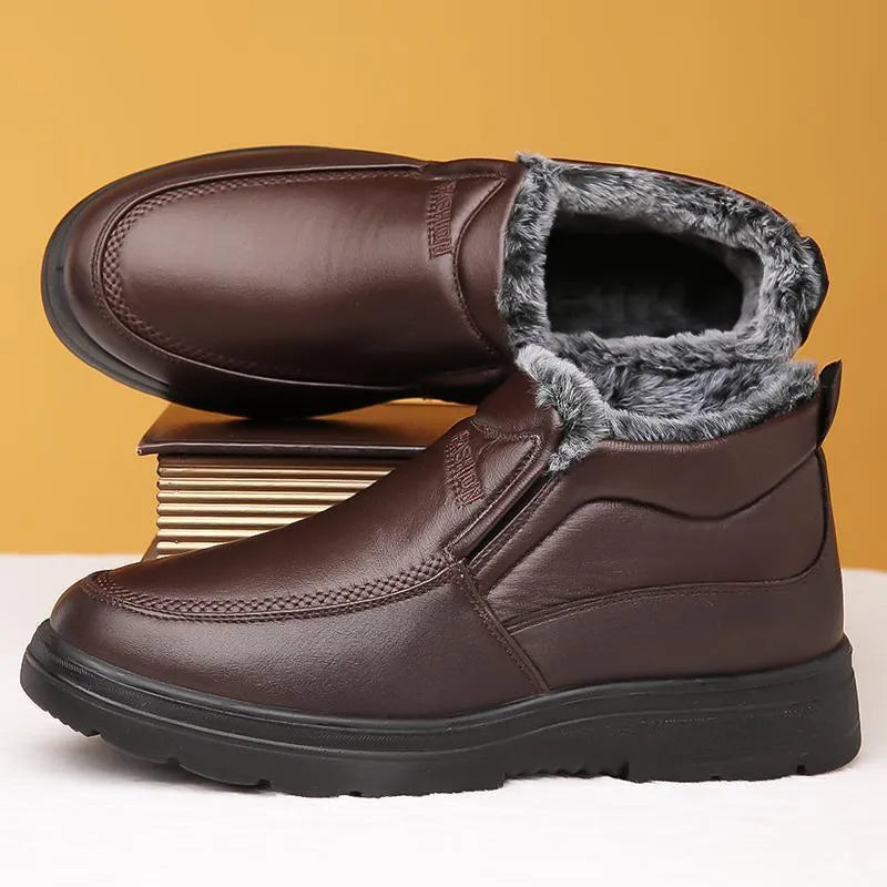 Men's black fleece-lined slip-on winter shoes with a rubber sole shown on a white background.