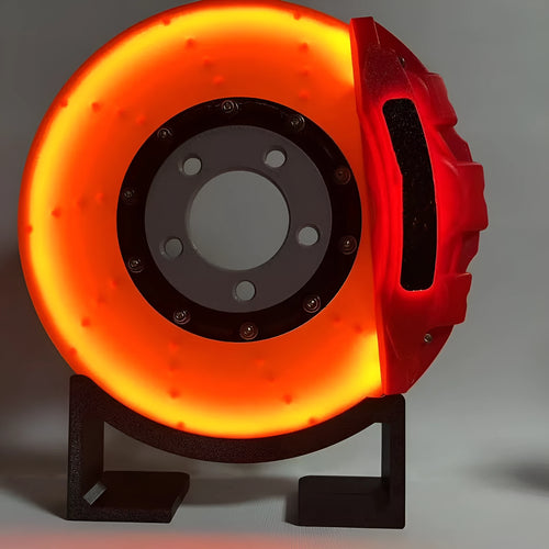 Brake disc themed LED desktop night light in blue caliper colour with touch control