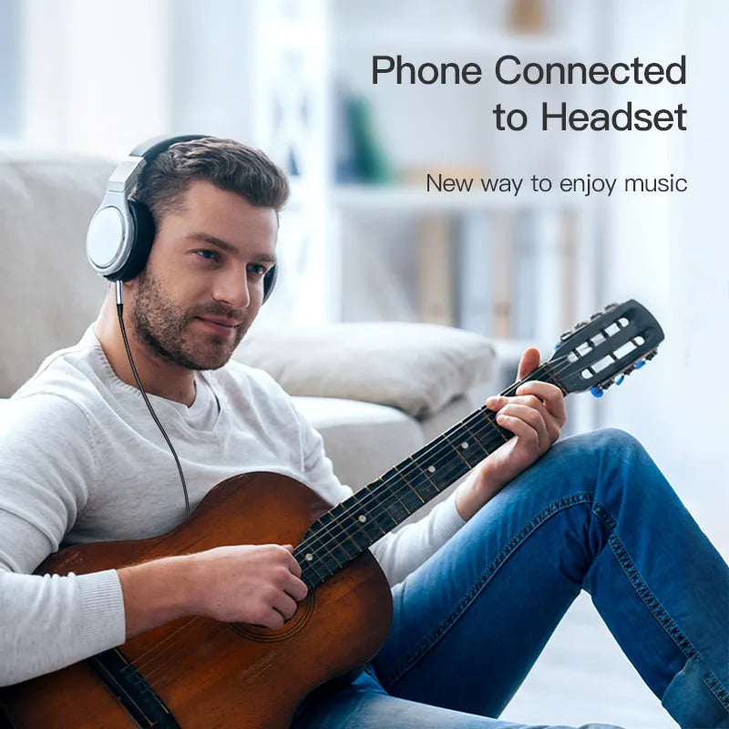 Silver nylon-braided 3.5mm male-to-male auxiliary audio cable with nickel connectors.