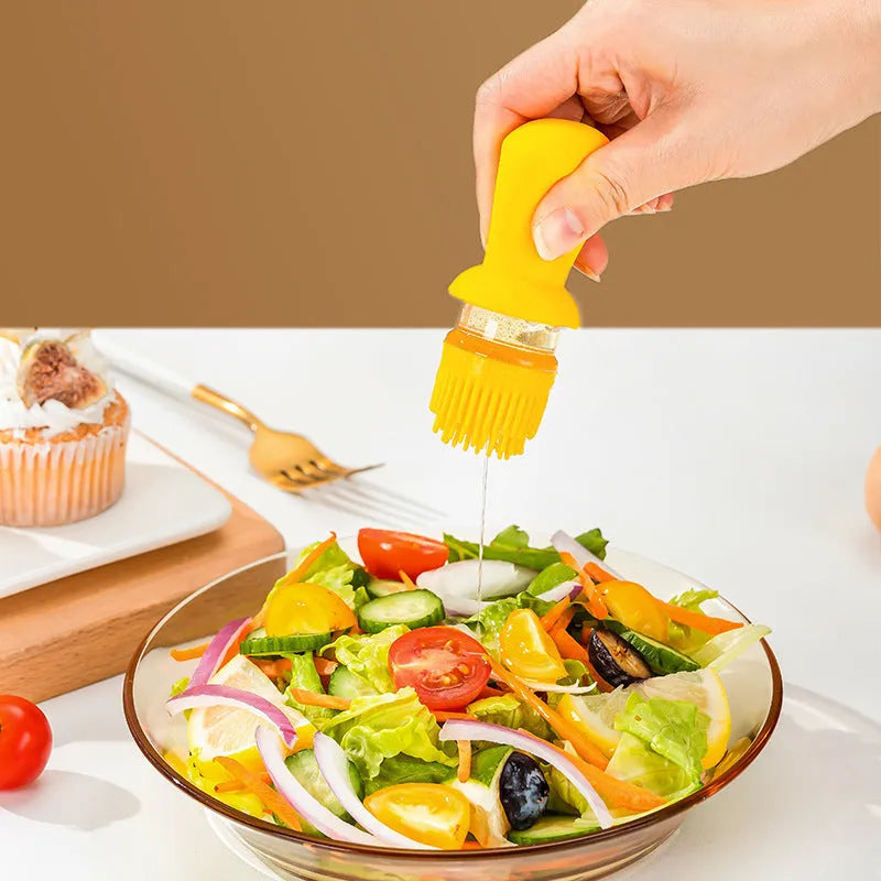 Transparent glass oil dispenser with silicone brush, stainless steel nozzle, in yellow, green, or brown.