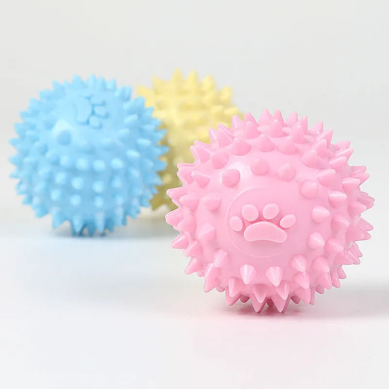 Blue TPR dog chewing ball with textured footprint design for teeth cleaning, 6cm diameter