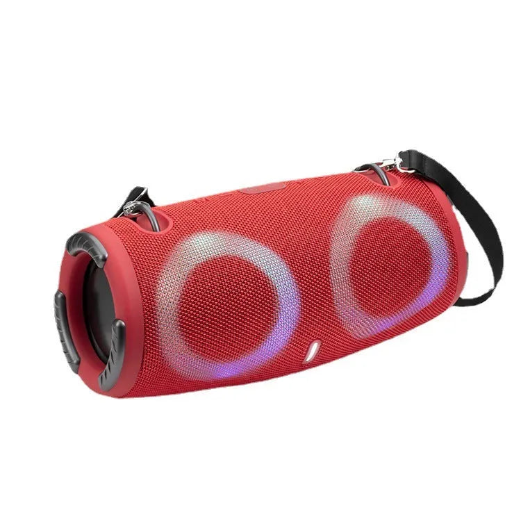 War Drum portable Bluetooth speaker with RGB lights in camouflage finish, showing carry strap and control buttons.