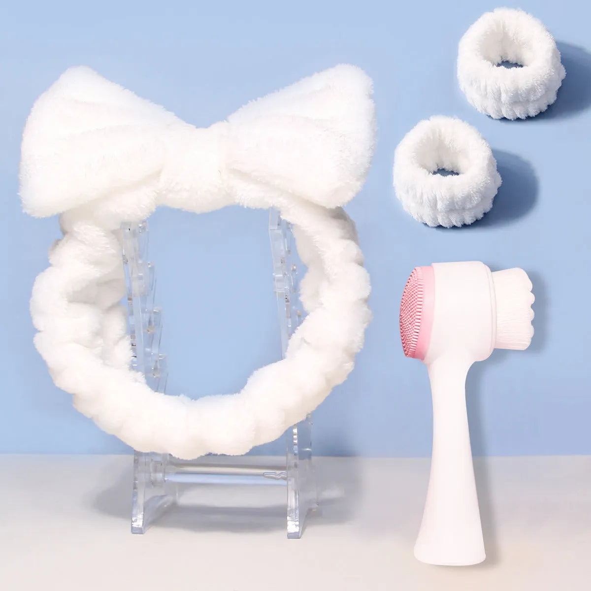Facial brush set with coral fleece hair band in multiple colours including purple, grey, white, and pink