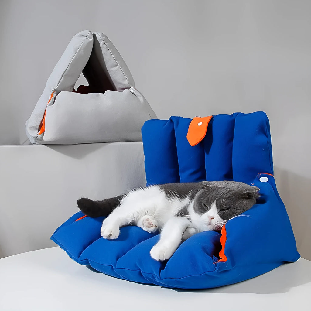 Blue triangular cat bed with raised sides and visible connection holes on a wooden floor.
