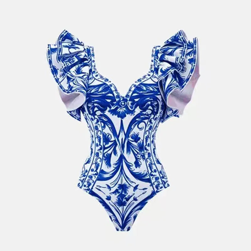 Women's floral printed one-piece polyester swimsuit on a hanger, showing skirted style.