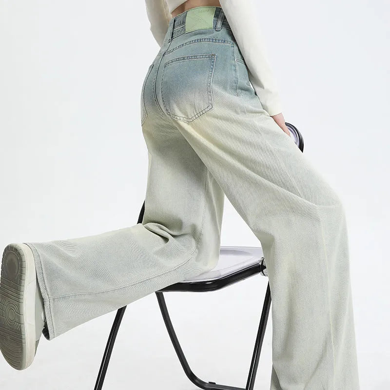 Women's gradient blue wide leg straight-leg denim trousers laid flat.