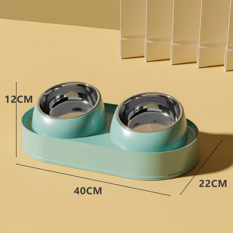 White elevated pet feeder with two tilted bowls on a wide base, for cats and small dogs.