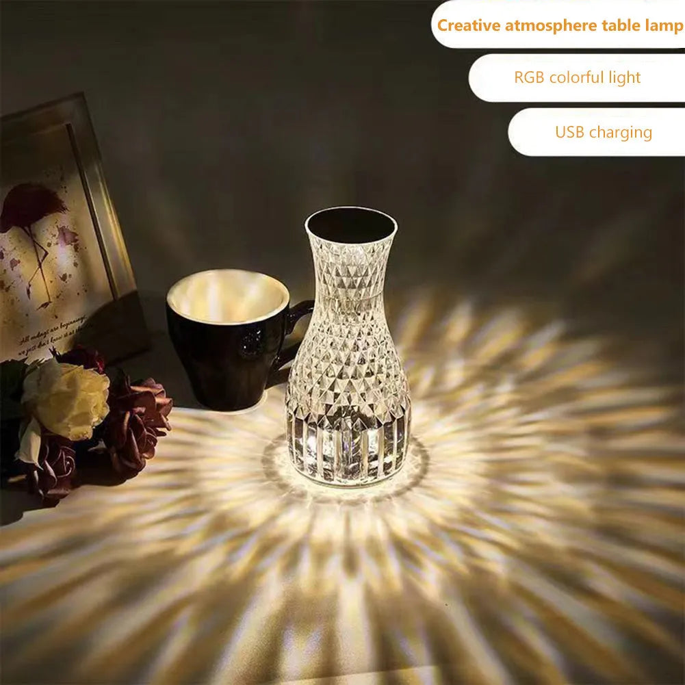 Vase-shaped crystal table lamp with diamond-like LED lighting on wooden surface