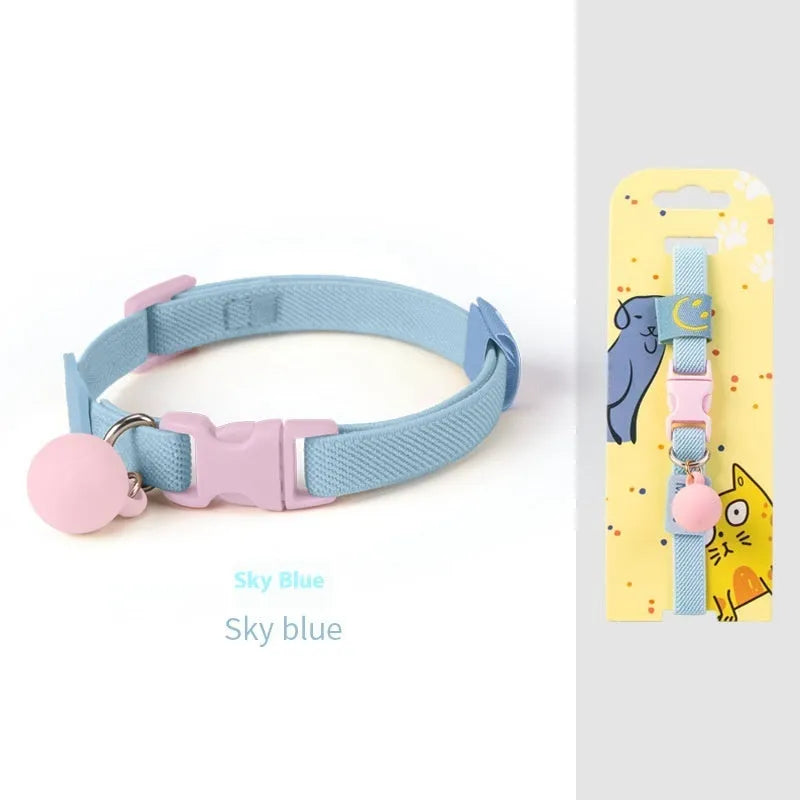 A stretchy yellow polyester dog collar for small breeds, shown adjusted to fit, with a metal D-ring.