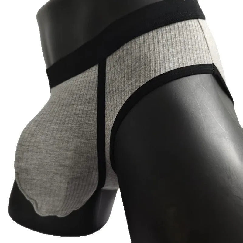 Men's solid colour U-shaped briefs in viscose fabric on a size chart background.