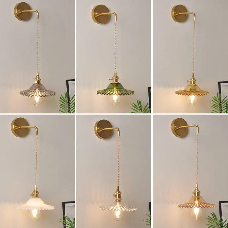 Retro brass lotus wall lamp with glass shade mounted on a beige wall, showcasing its copper arm and layered design.