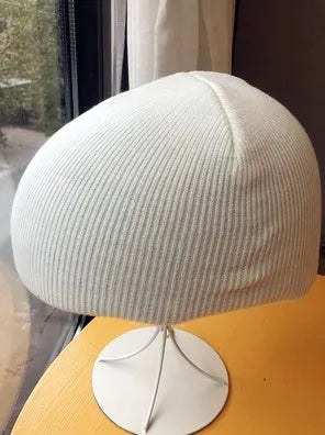 L-sized ski helmet with a knitted decorative cover and matching beanie in a choice of 15 colours.
