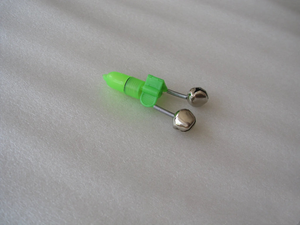Two fishing bell bite alarms with LED lights, one green one red, clipped onto a fishing rod tip