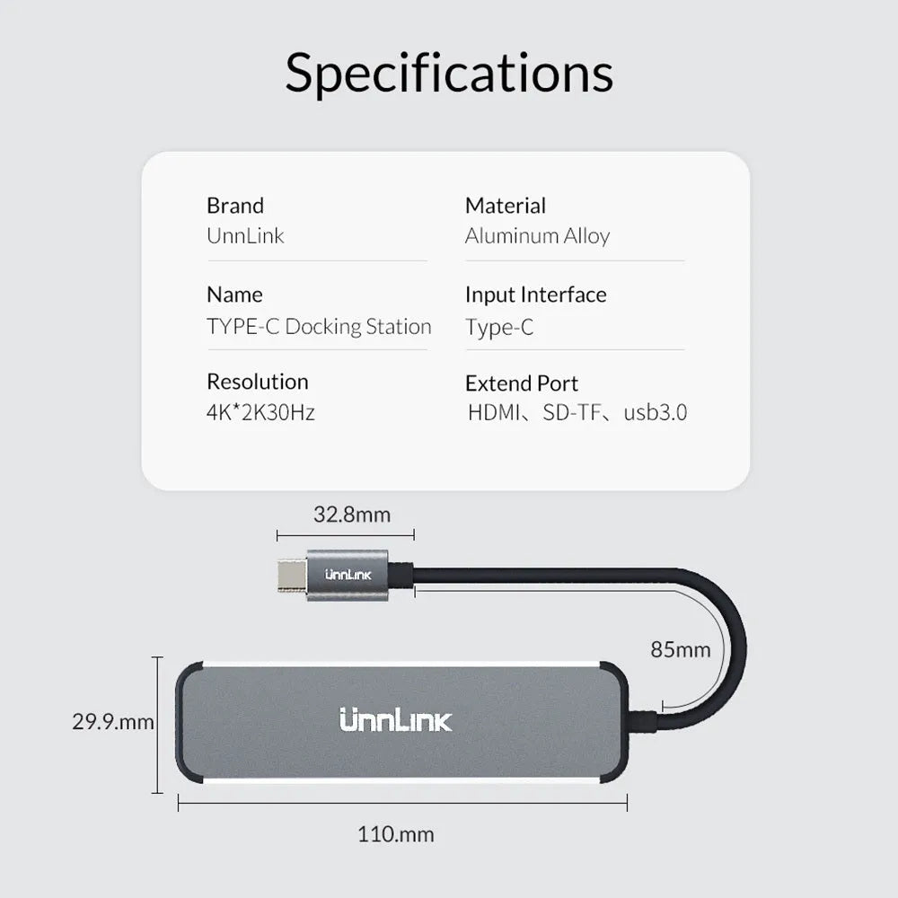 Silver aluminium alloy type-C docking station with HDMI, SD/TF card reader, and USB 3.0 ports on a desk