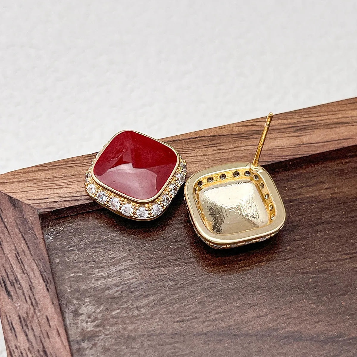 Red geometric square alloy earrings with clip-on fastening and embedded square design elements