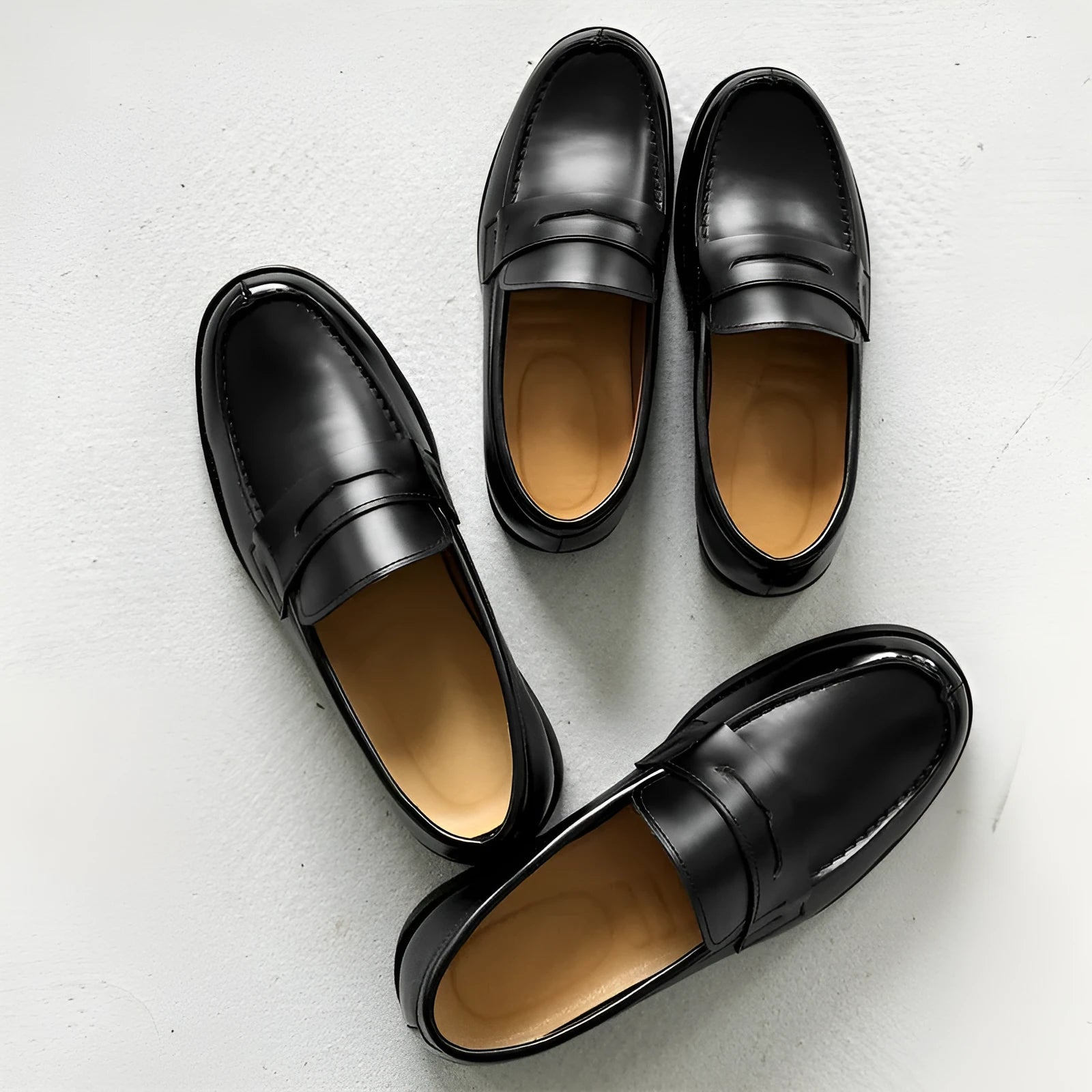 Black men's classic slip-on derby leather shoes with a rubber sole on a white background