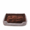 A grey and white striped bolster-sided pet bed for dogs or cats with a removable cloth cover.