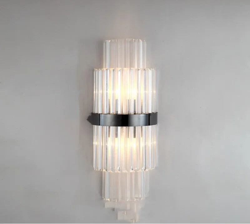 Modern crystal wall lamp with petal design and titanium gold finish mounted on wall