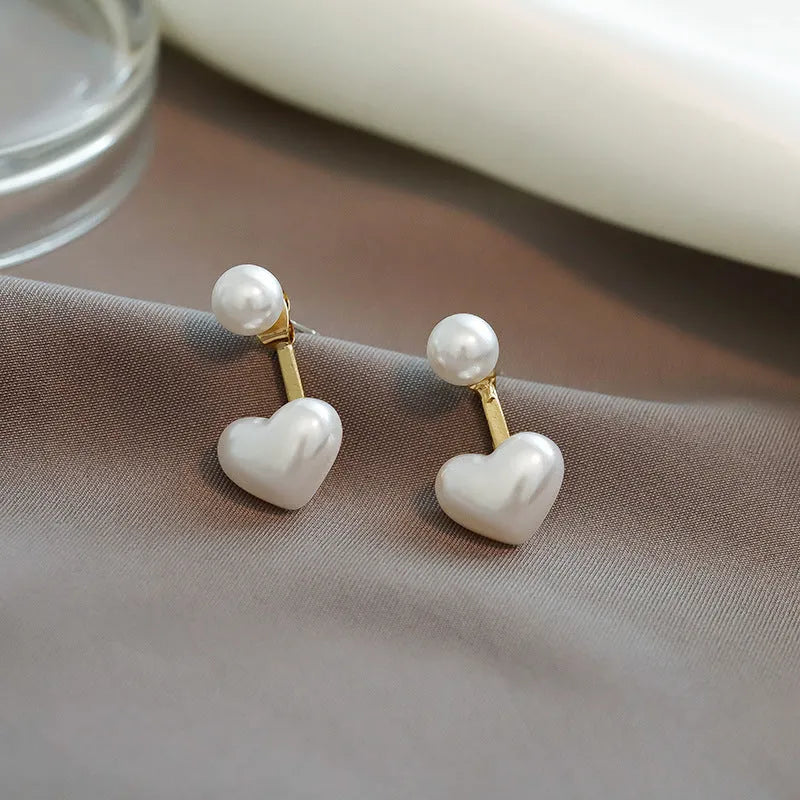 Women's heart-shaped pearl stud earrings with Korean style design and electroplated alloy construction