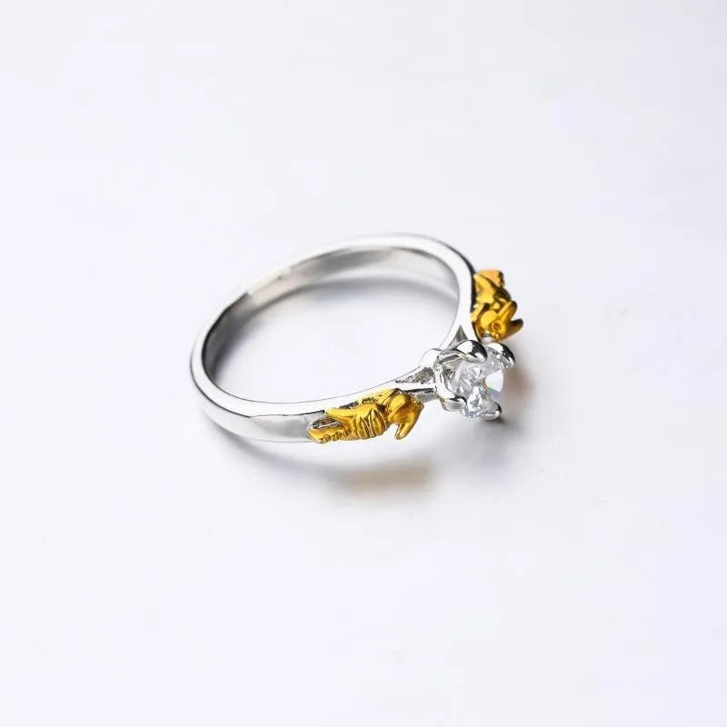 Close-up of a black gold finished copper ring with a detailed 1.5cm tall crown model on a person's finger.
