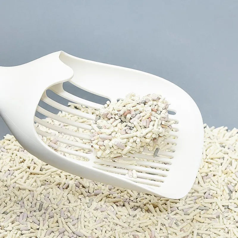 White plastic cat litter scoop with base, 29.5 x 12.8 cm, for cleaning cat litter trays