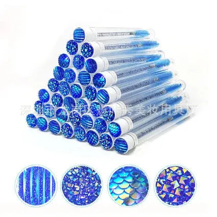 Set of coloured disposable mascara brushes inside clear plastic storage tubes on a white background.