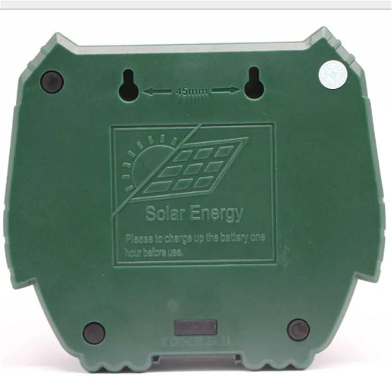 Green solar-powered ultrasonic animal repeller unit for outdoor pest and dog control.