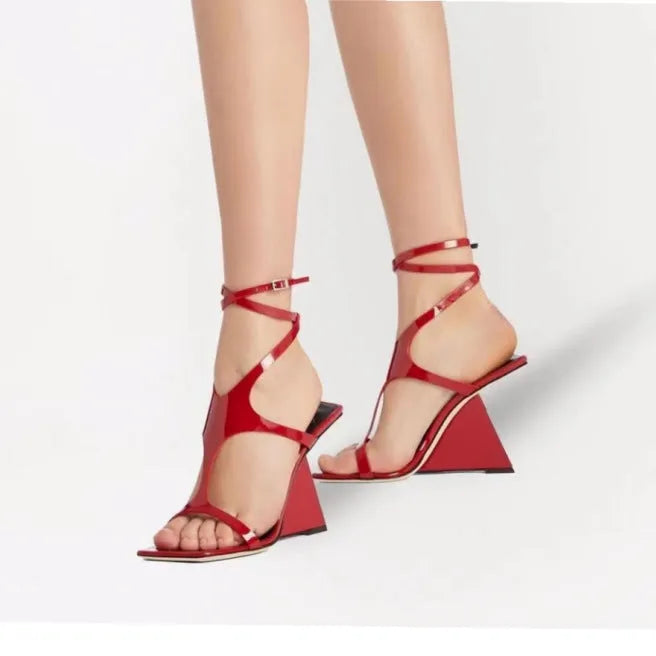 Women's black high heel sandals with a square toe and button ankle strap on a white background.