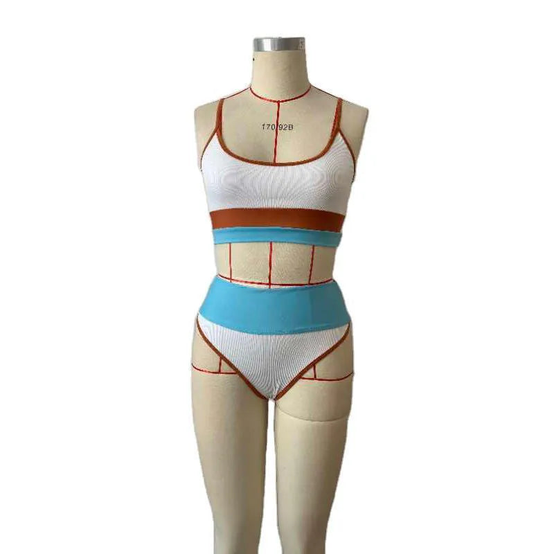 Women's solid colour two-piece swimsuit with matching top and shorts for swimming