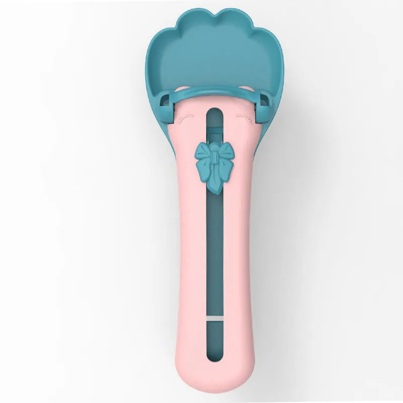 Green and pink pet feed spoon with extrusion design and squeezer feeder function for cat treats and liquid foods