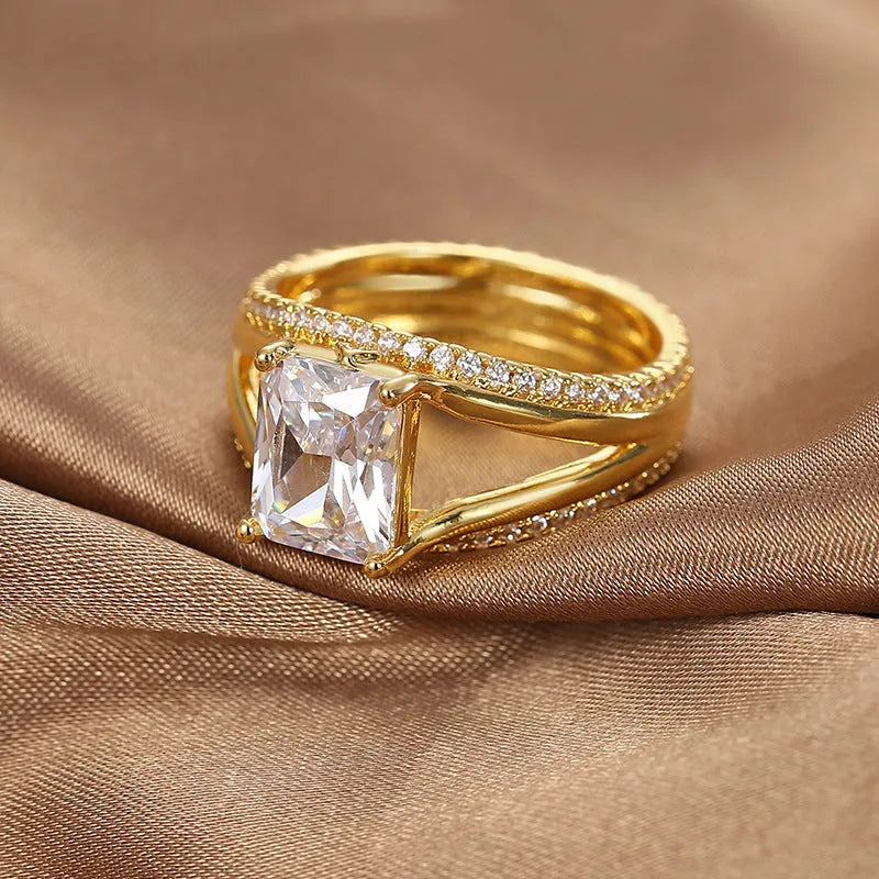 Geometric women's ring with square zircon stone and gold electroplated finish on copper