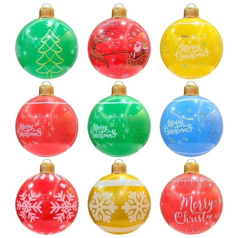 Large red and white inflatable Christmas ball with flashing lights in a garden setting