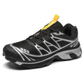 Pair of low-top hiking shoes in artificial leather with a mesh lining and rubber sole.
