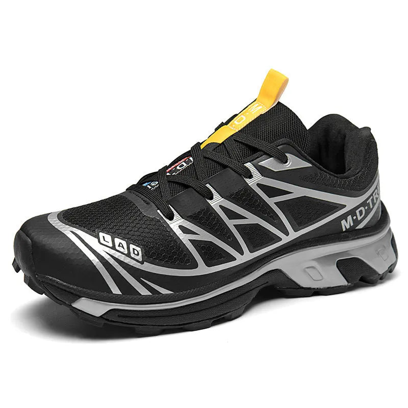 Pair of low-top hiking shoes in artificial leather with a mesh lining and rubber sole.