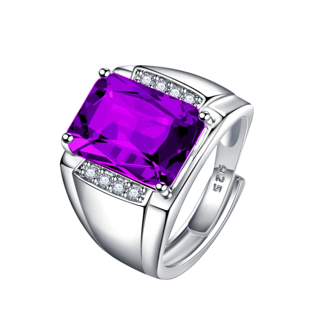 Adjustable copper geometric ring with a natural amethyst coloured gemstone on a model's finger.