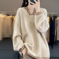 Women's camel-coloured V-neck long sleeve viscose pullover sweater on a hanger.