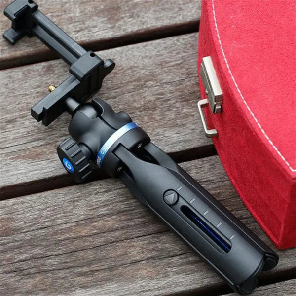 Black desktop mobile phone tripod stand with aluminium alloy legs and a plastic lazy bracket holder.