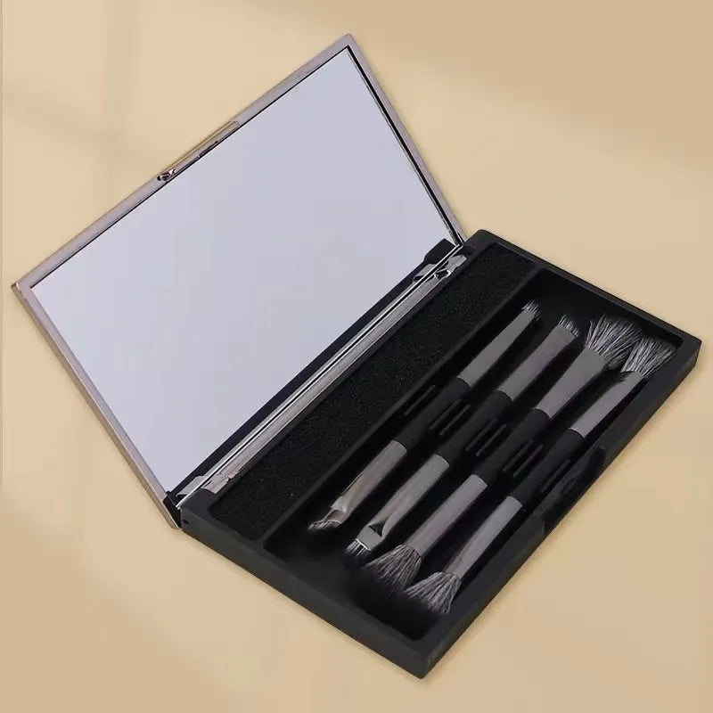 Silver and gold makeup brush sets in a case with a mirror, showing artificial fibre bristles.