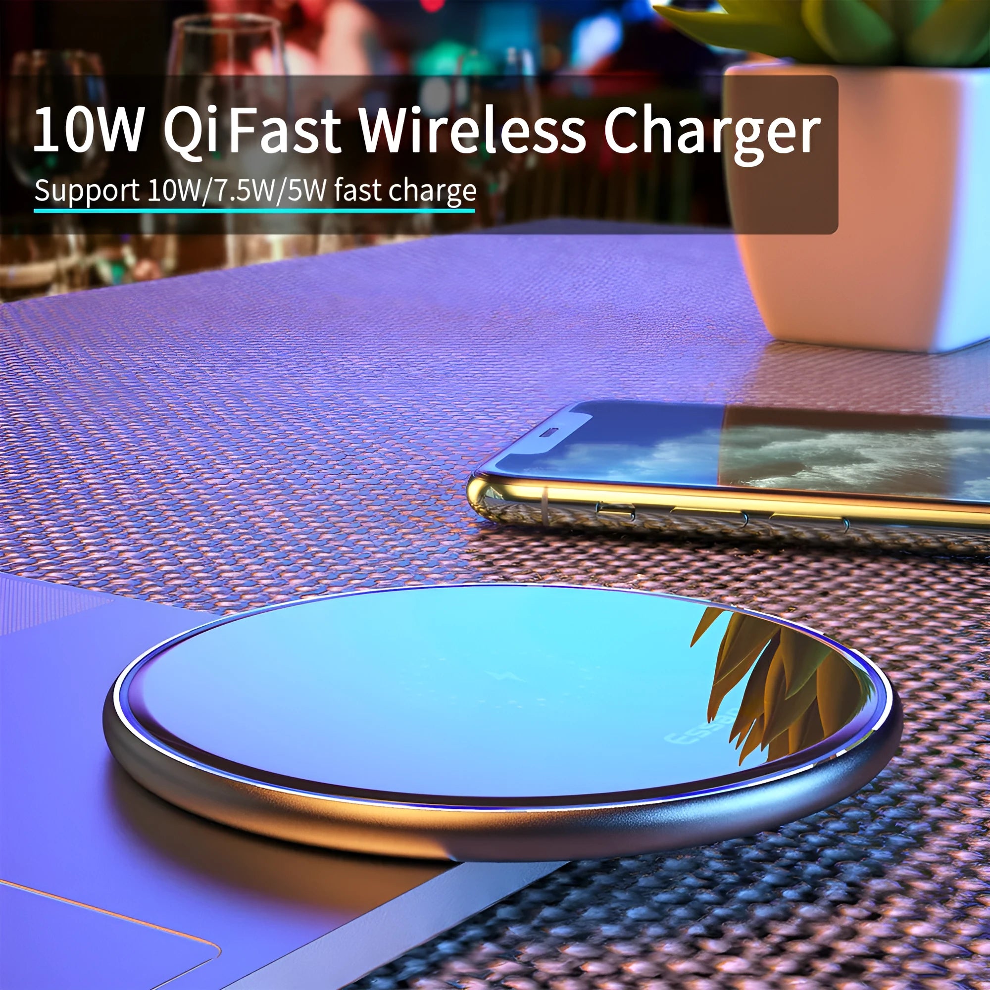 Black aluminium alloy 15W Qi fast wireless charging pad on a wooden desk