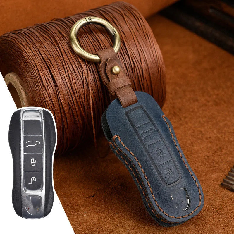 Porsche leather key cover with retro bag buckle in blue and brown colour options