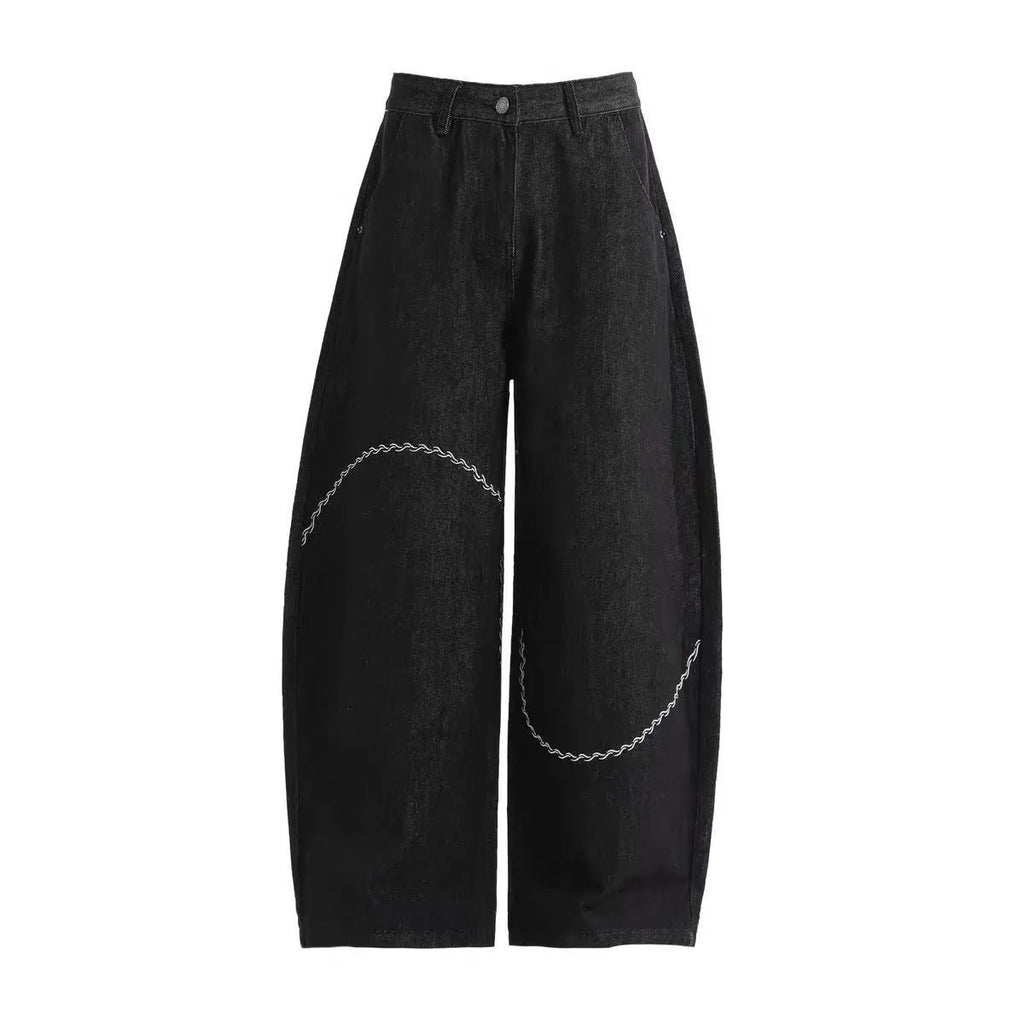 Black straight leg denim trousers with micro elastic waistband and zip fly placket detail