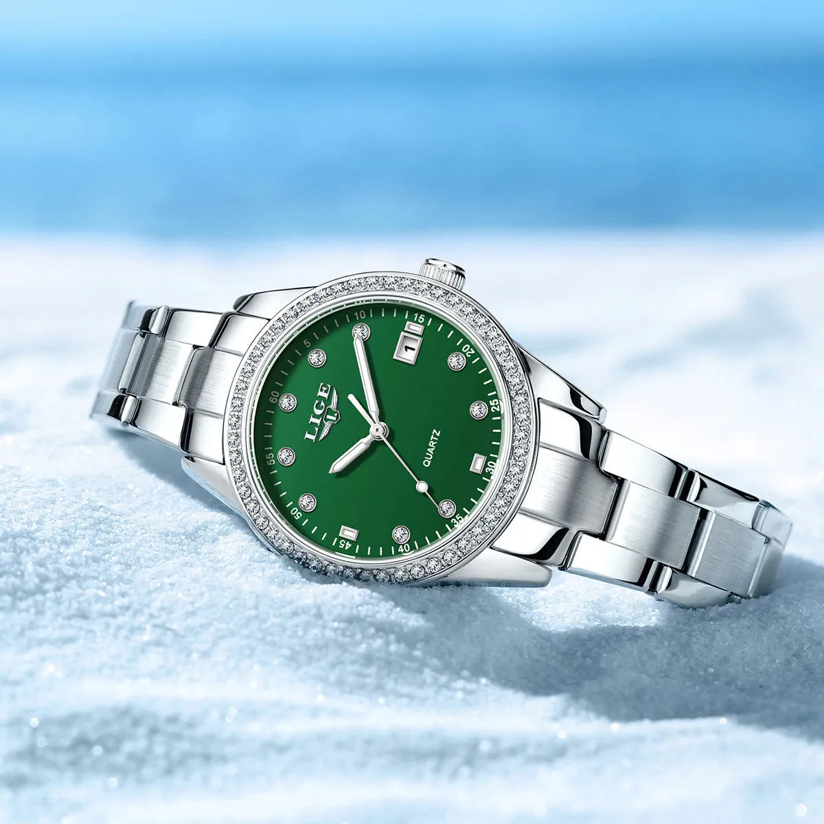 Silver fashion quartz watch with diamond markers on a 34mm stainless steel case and luminous hands.
